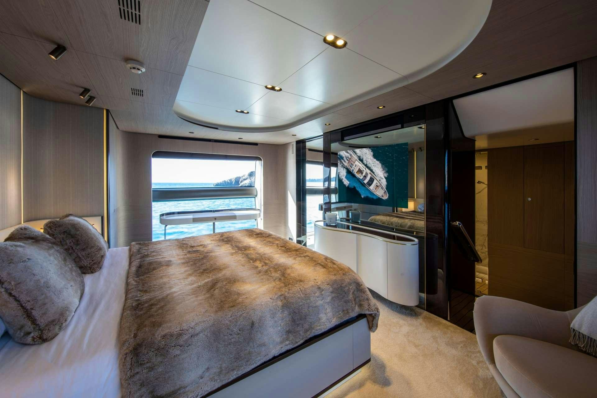 a bedroom with a large bed aboard AKAMA Yacht for Charter