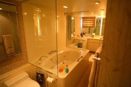 a bathroom with a bathtub and sink aboard PANACHE Yacht for Charter