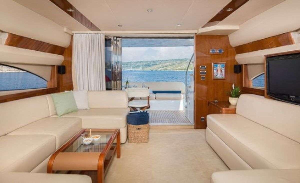 a living room with a large window aboard Anna Wo Yacht for Charter