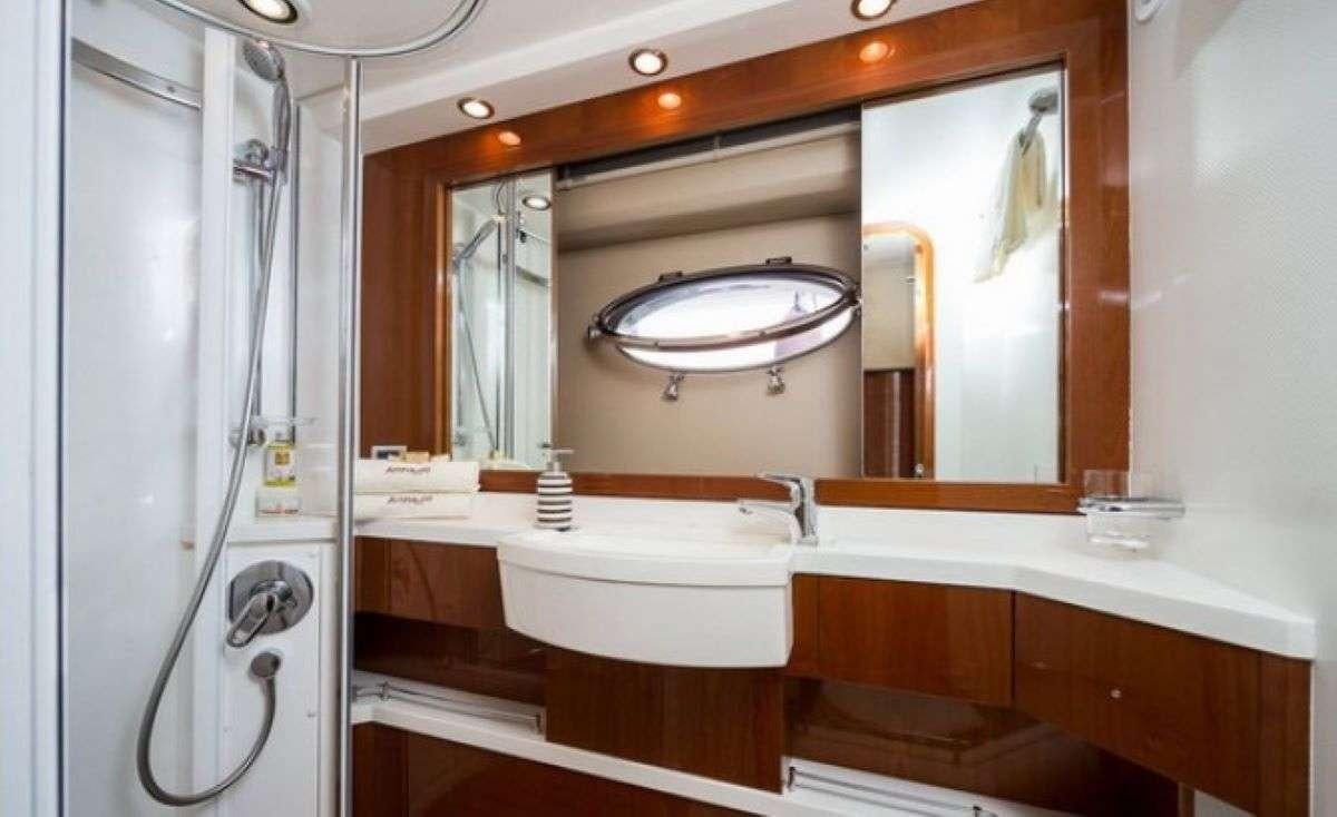a bathroom with a large mirror aboard Anna Wo Yacht for Charter