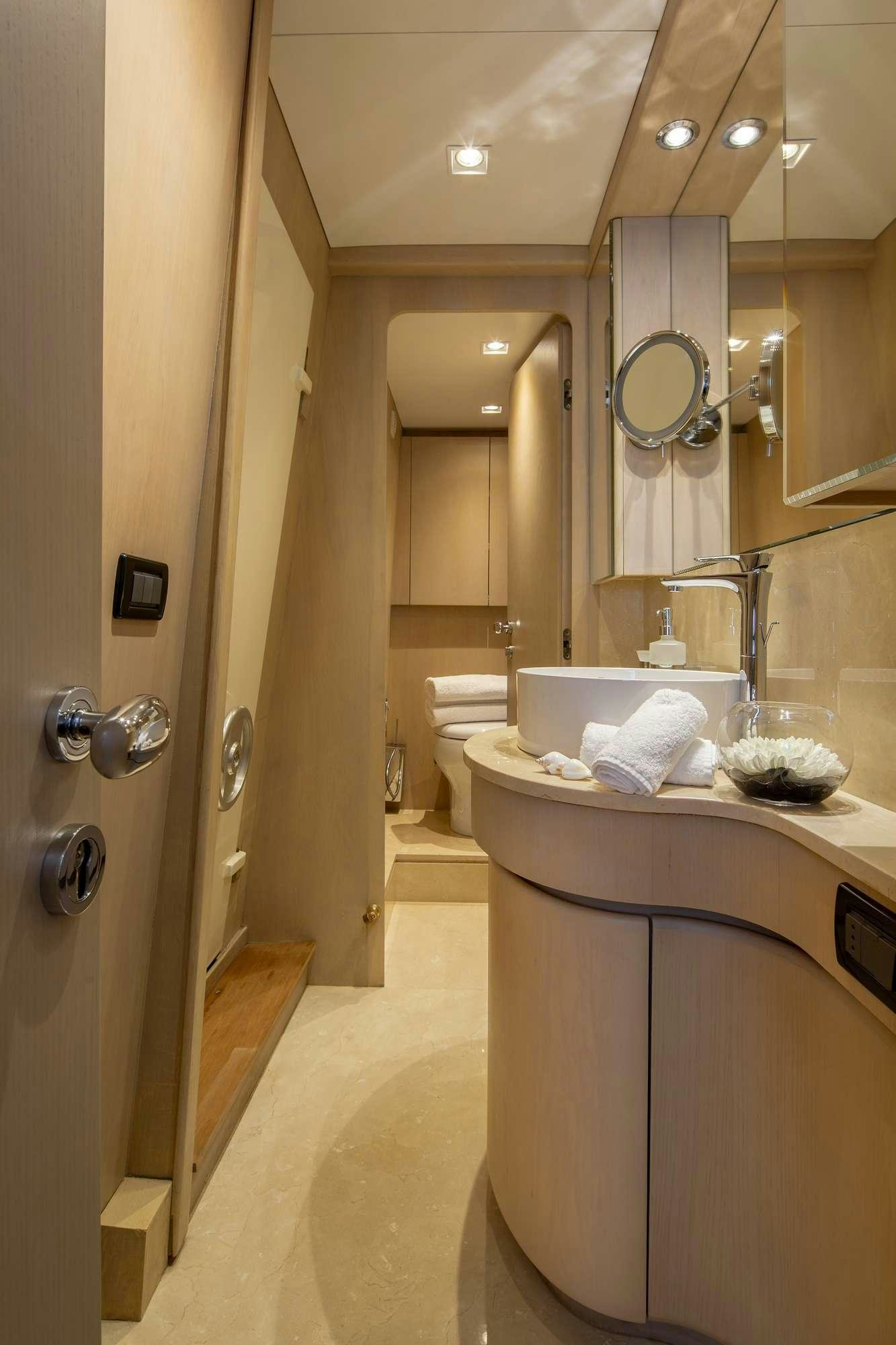 a bathroom with a countertop sink and mirror aboard SUMMER FUN Yacht for Charter