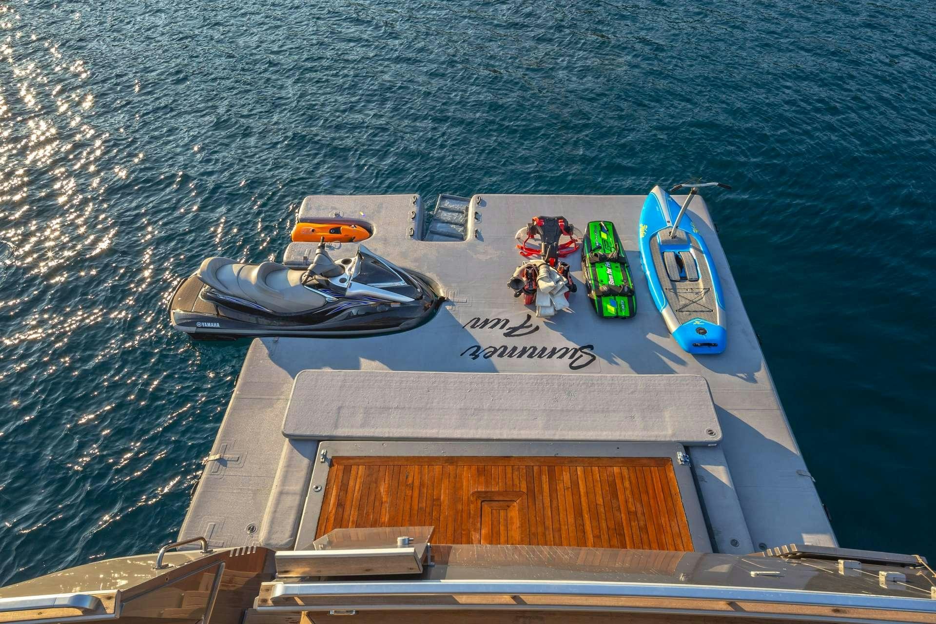 a group of boats on a body of water aboard SUMMER FUN Yacht for Charter
