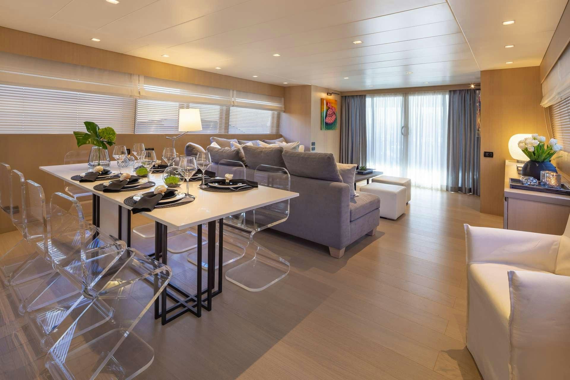 a living room with a couch and a table aboard SUMMER FUN Yacht for Charter