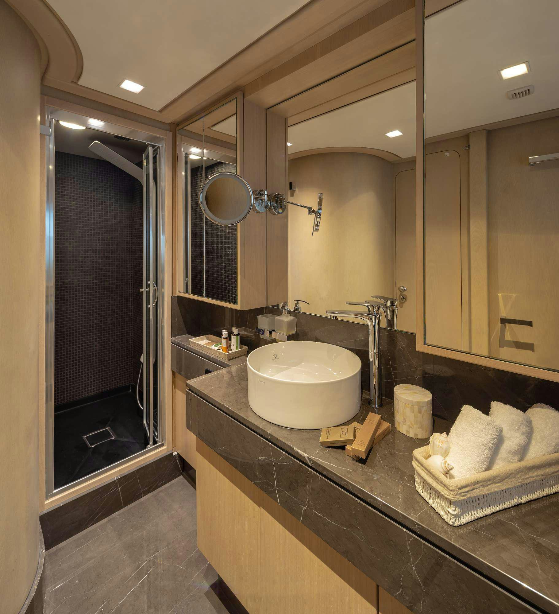 a bathroom with a sink and a mirror aboard SUMMER FUN Yacht for Charter