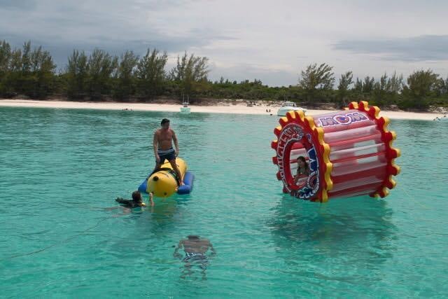 a person on a raft in the water with a dog aboard ATLANTIS II Yacht for Charter
