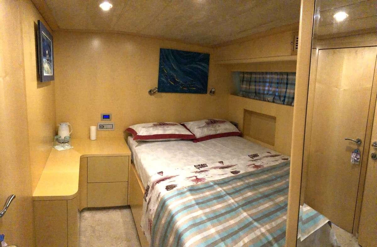 a bed in a room aboard RIGEL Yacht for Charter