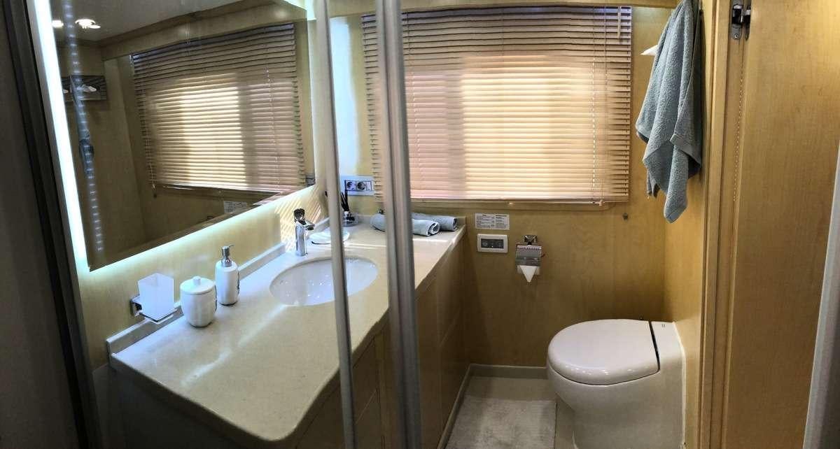 a bathroom with a sink and toilet aboard RIGEL Yacht for Charter
