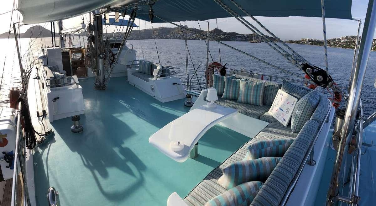 a boat with a blue cover aboard RIGEL Yacht for Charter