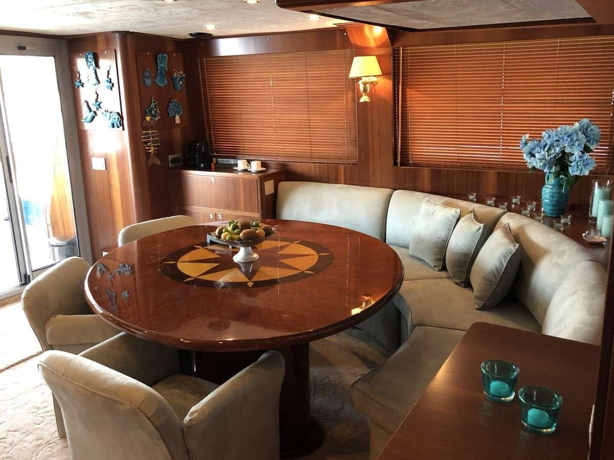 a living room with a couch and a table aboard RIGEL Yacht for Charter