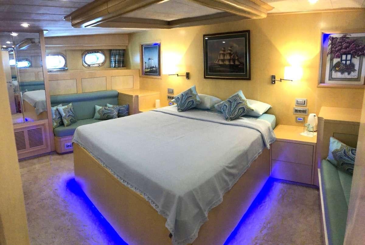 a bed in a room aboard RIGEL Yacht for Charter