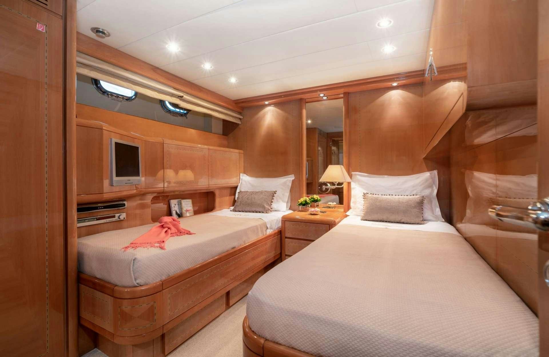 a room with two beds aboard TURN ON Yacht for Charter