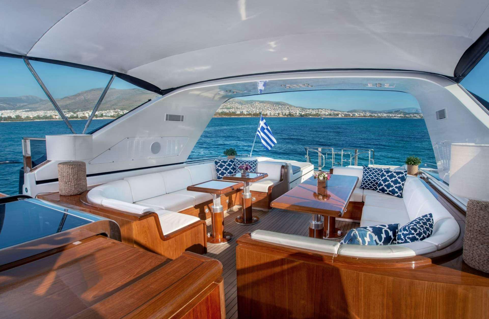 a room with a view of the ocean and a large cruise ship aboard TURN ON Yacht for Charter