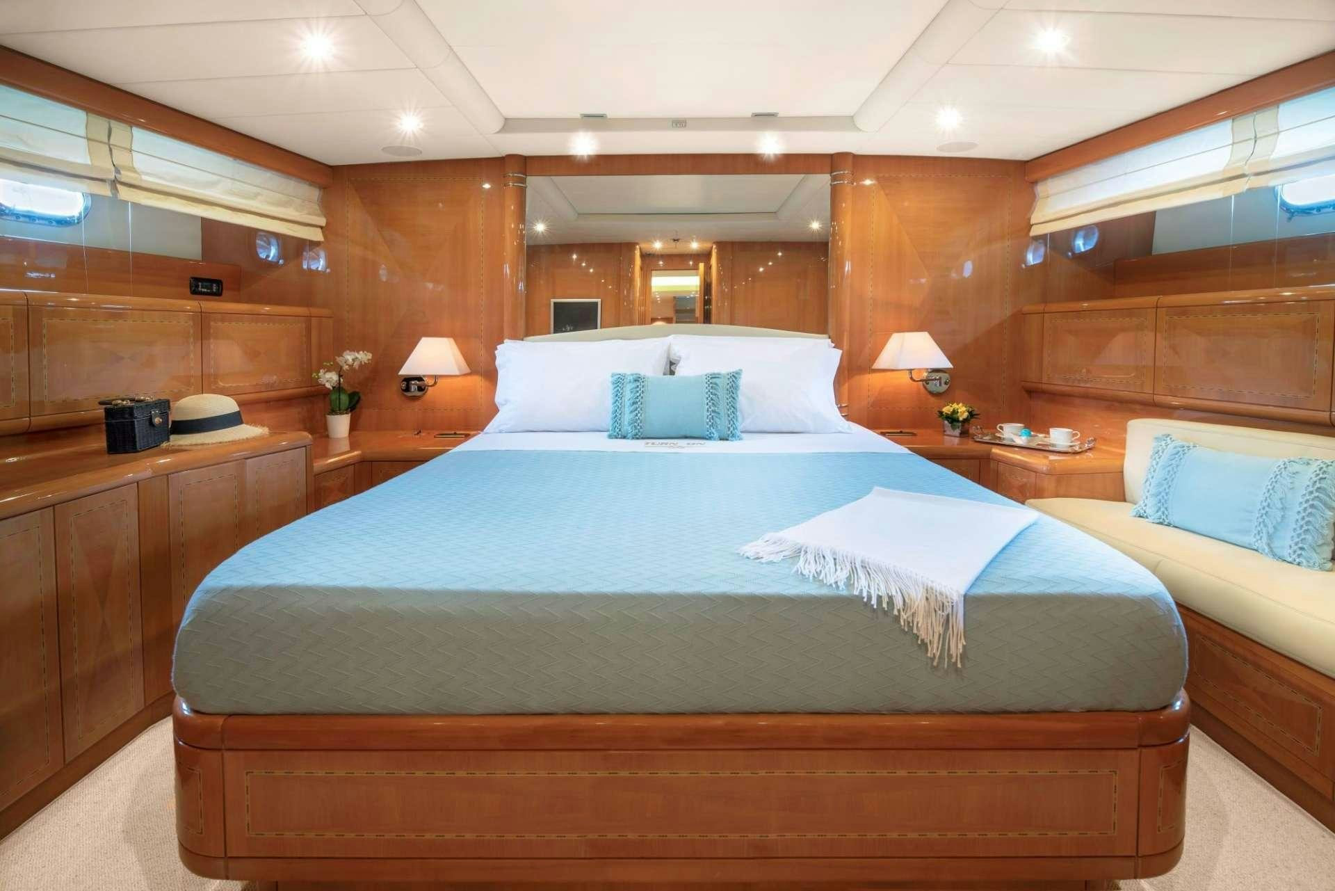 a large bed in a room aboard TURN ON Yacht for Charter