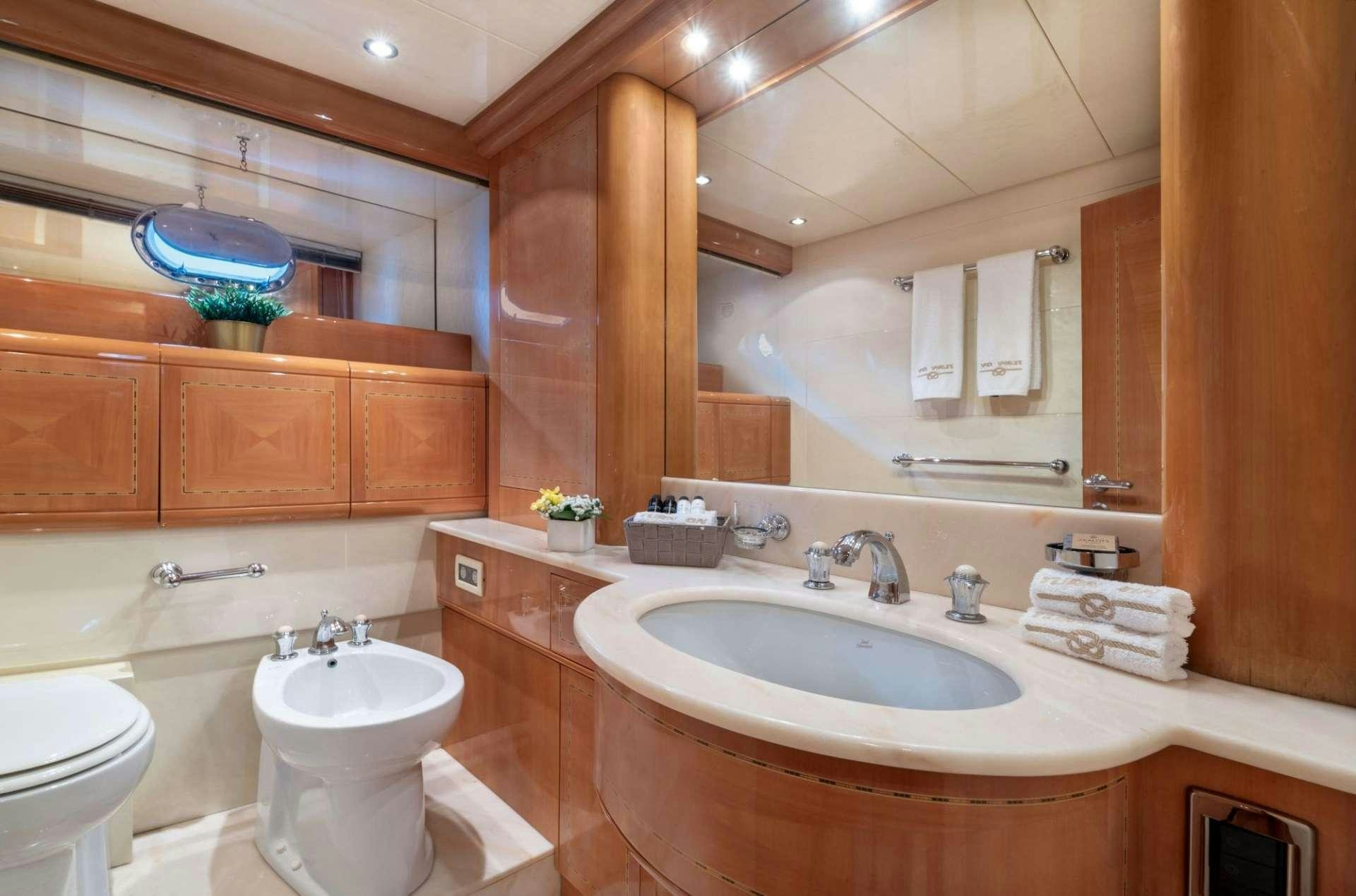 a bathroom with a sink and a toilet aboard TURN ON Yacht for Charter