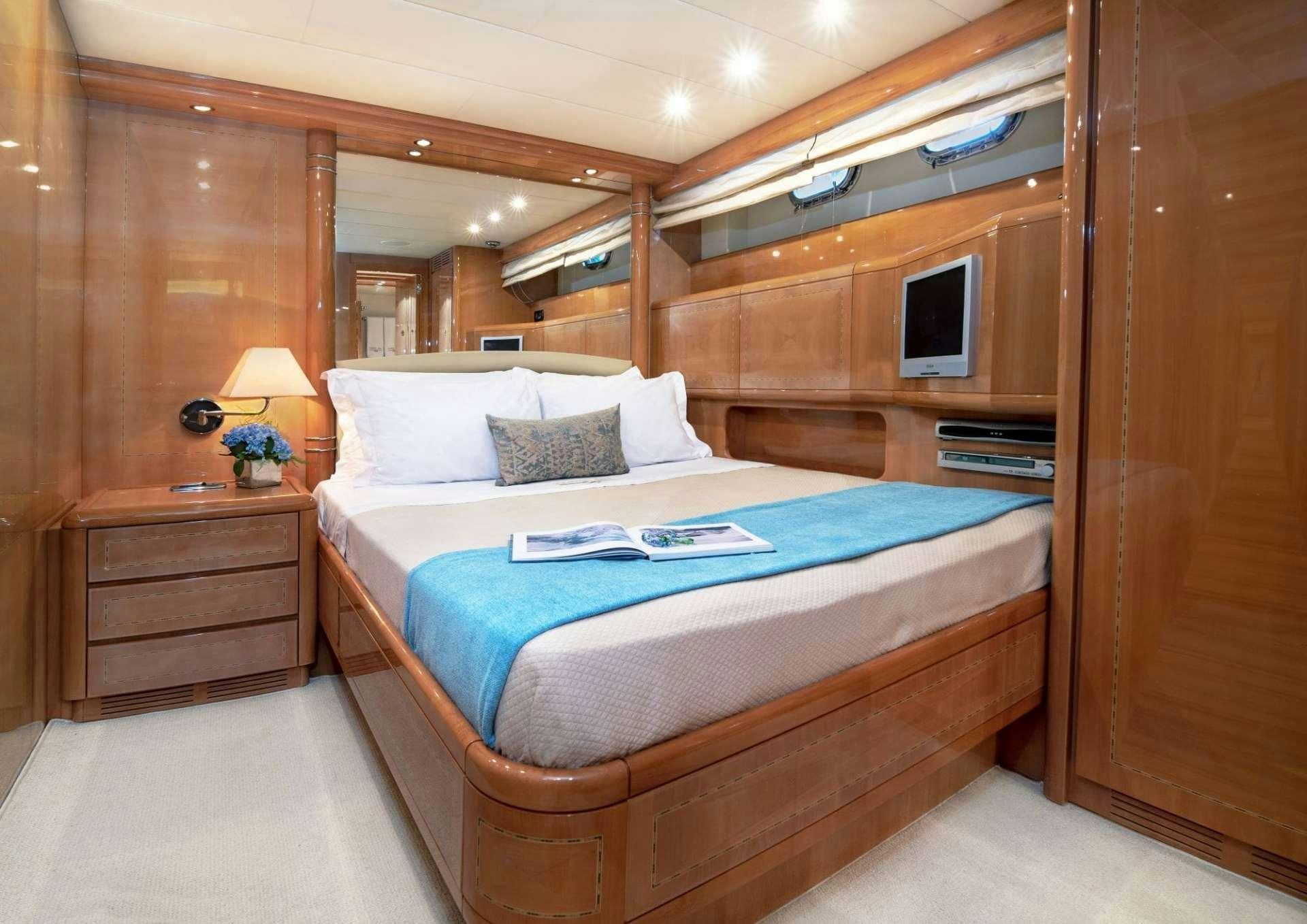 a bed in a cabin aboard TURN ON Yacht for Charter
