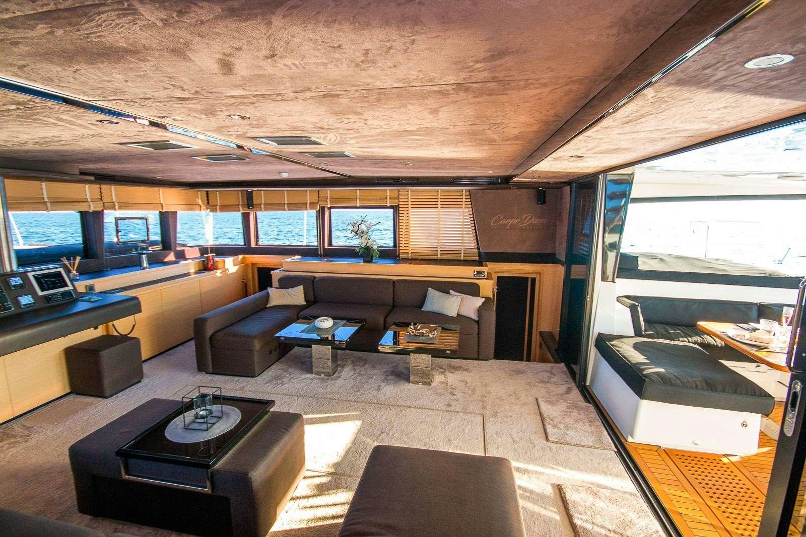 an empty room with a large window aboard CARPE DIEM Yacht for Charter