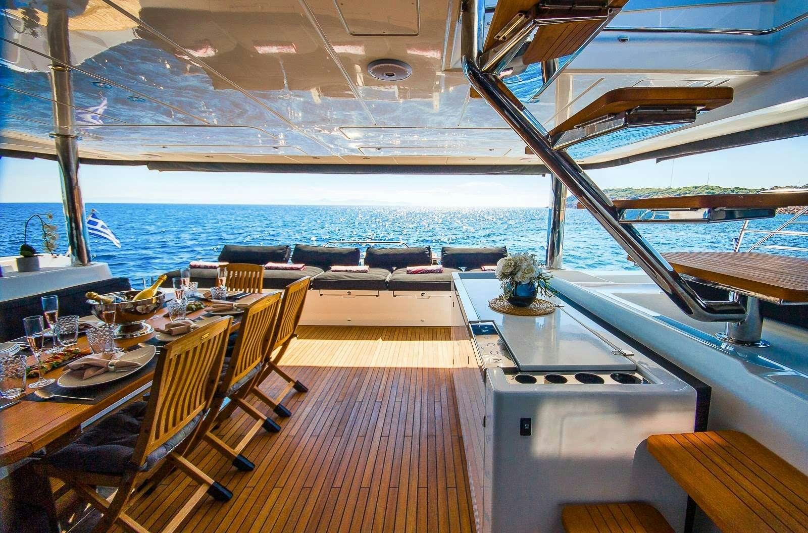 a room with a table and chairs aboard CARPE DIEM Yacht for Charter