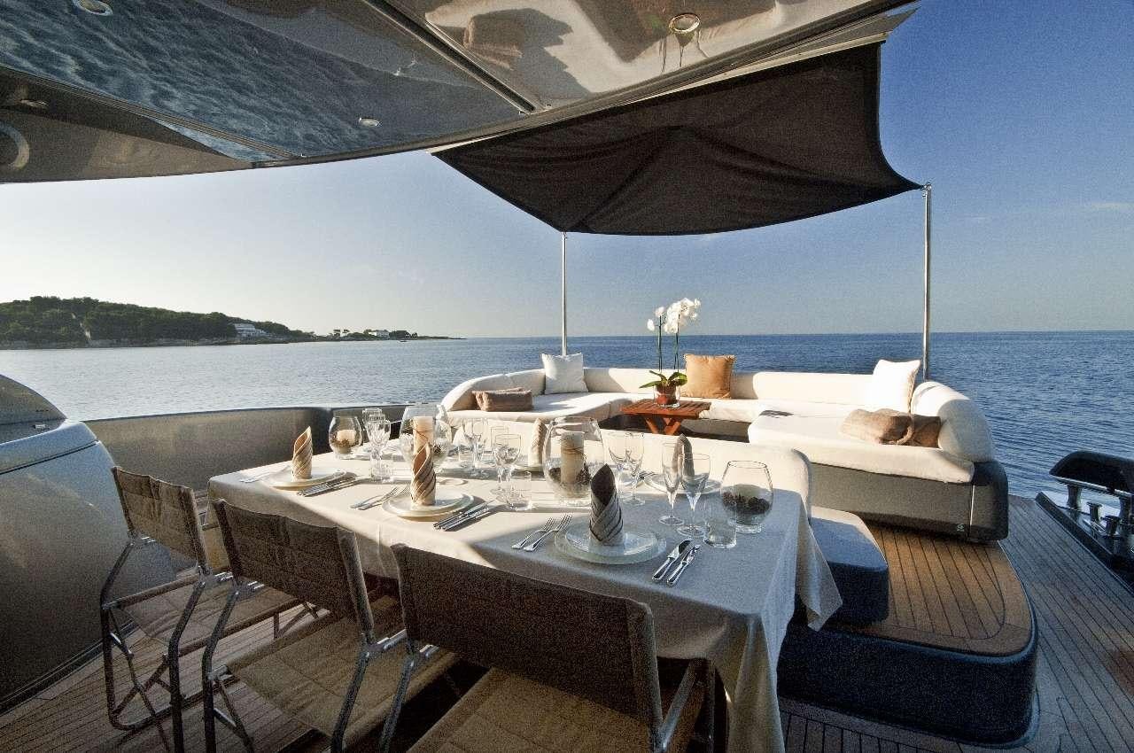 a table set for a meal on a boat aboard RHINO A Yacht for Charter