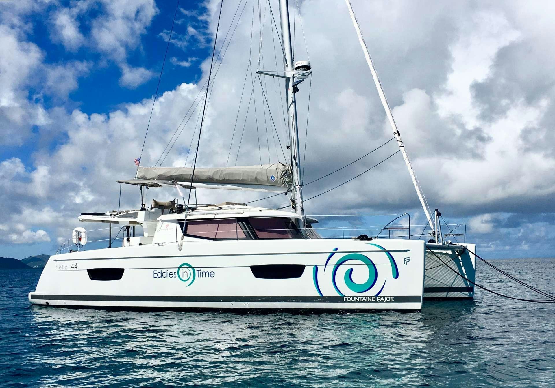 a white boat in the water aboard EDDIES IN TIME Yacht for Charter