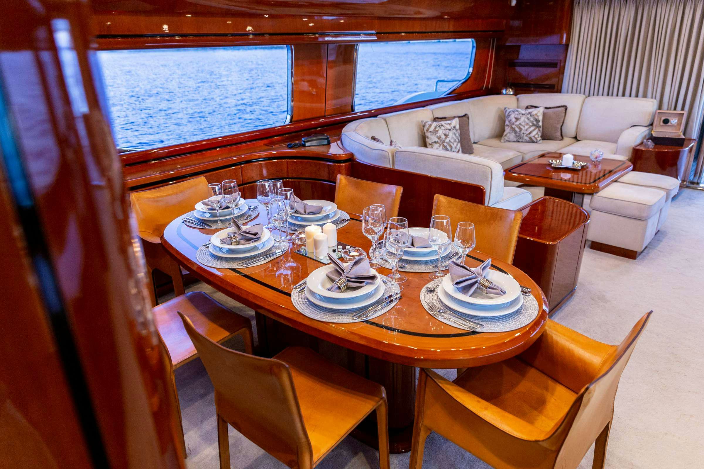 a dining table set for a meal aboard PAREAKI Yacht for Charter