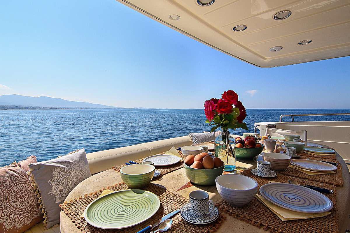 a table with food on it aboard PAREAKI Yacht for Charter