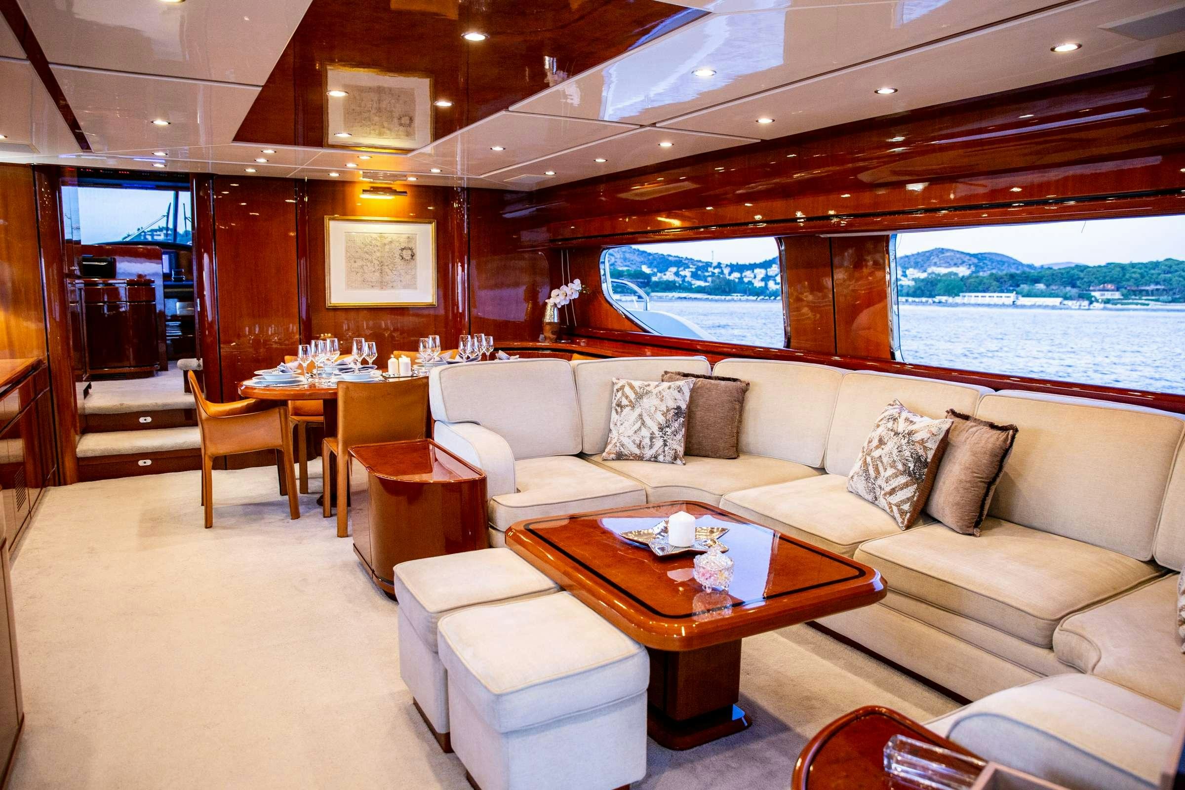 a living room with a large window aboard PAREAKI Yacht for Charter