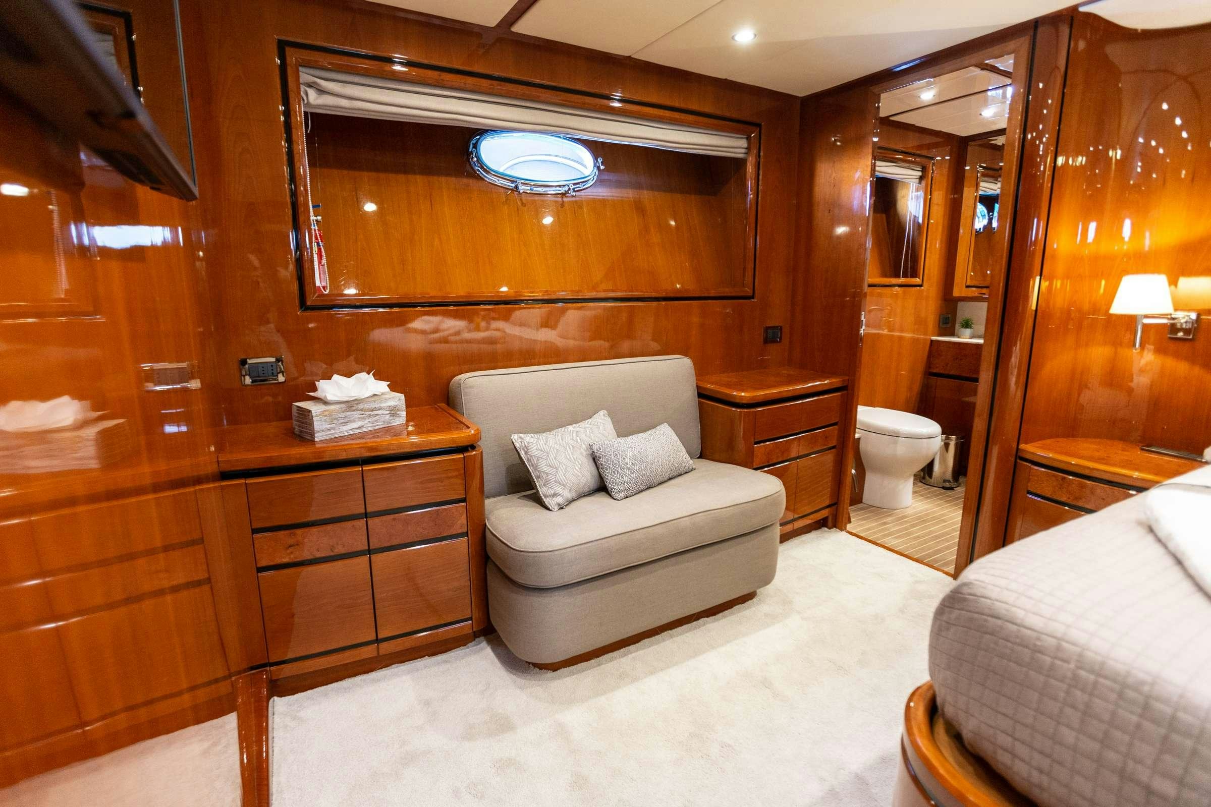a bathroom with a bed and a mirror aboard PAREAKI Yacht for Charter