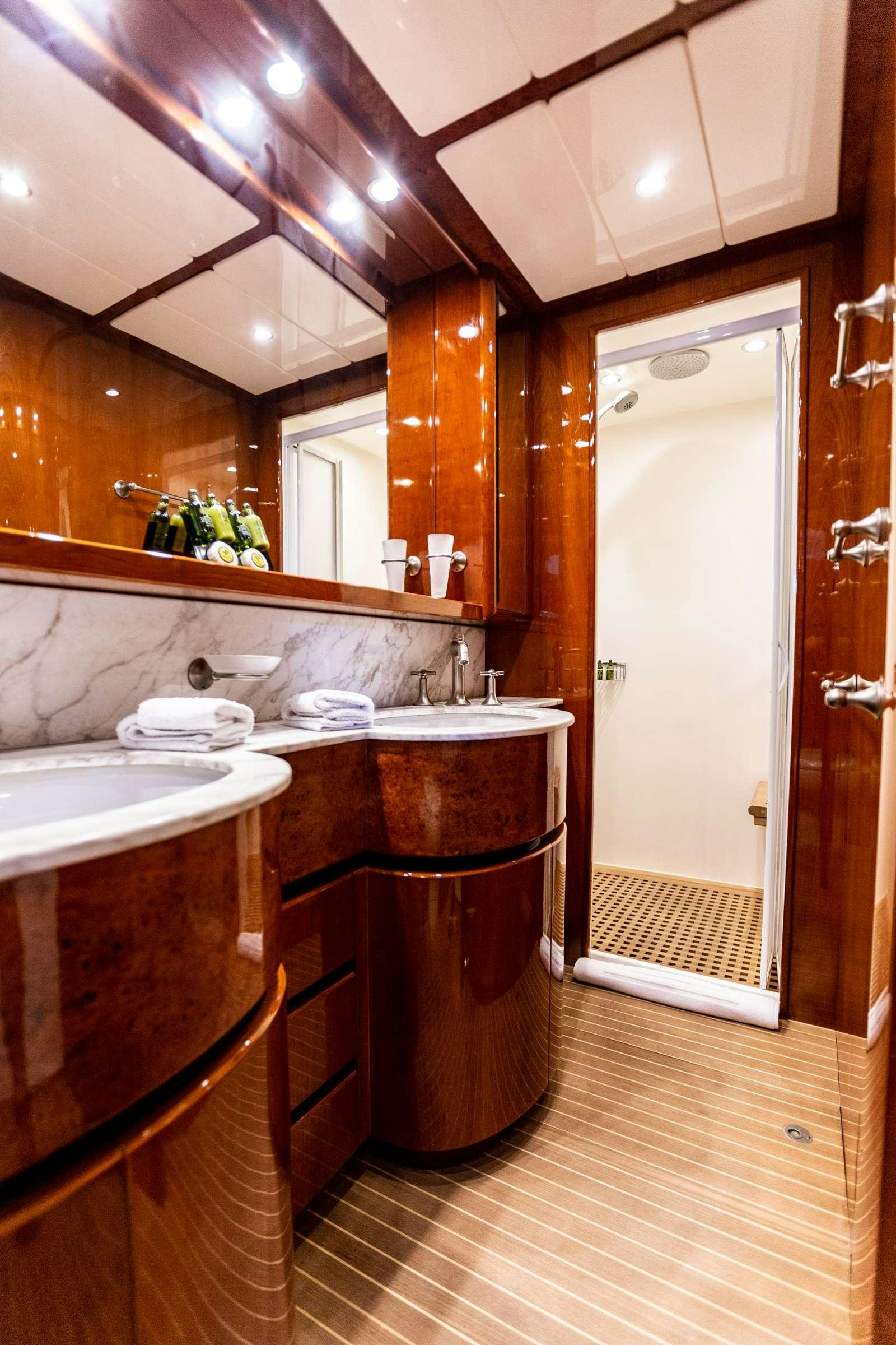 a bathroom with a sink and a mirror aboard PAREAKI Yacht for Charter