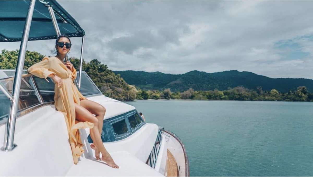 a person sitting on a boat aboard DEMAREST Yacht for Charter