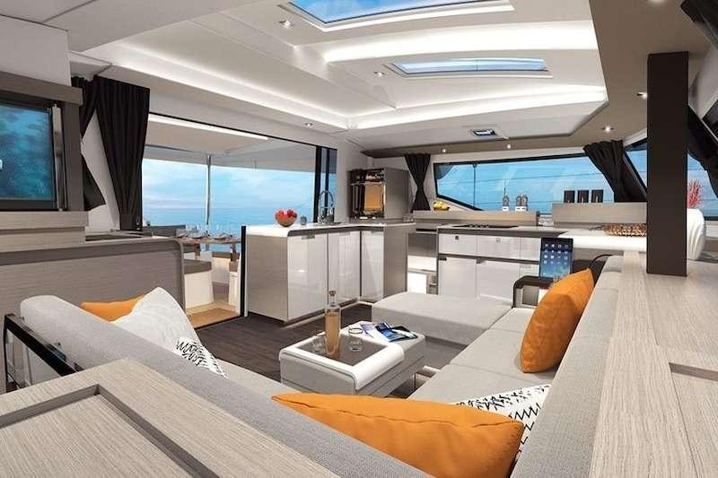 a room with a large window and a large bed aboard HERO'S JOURNEY Yacht for Charter