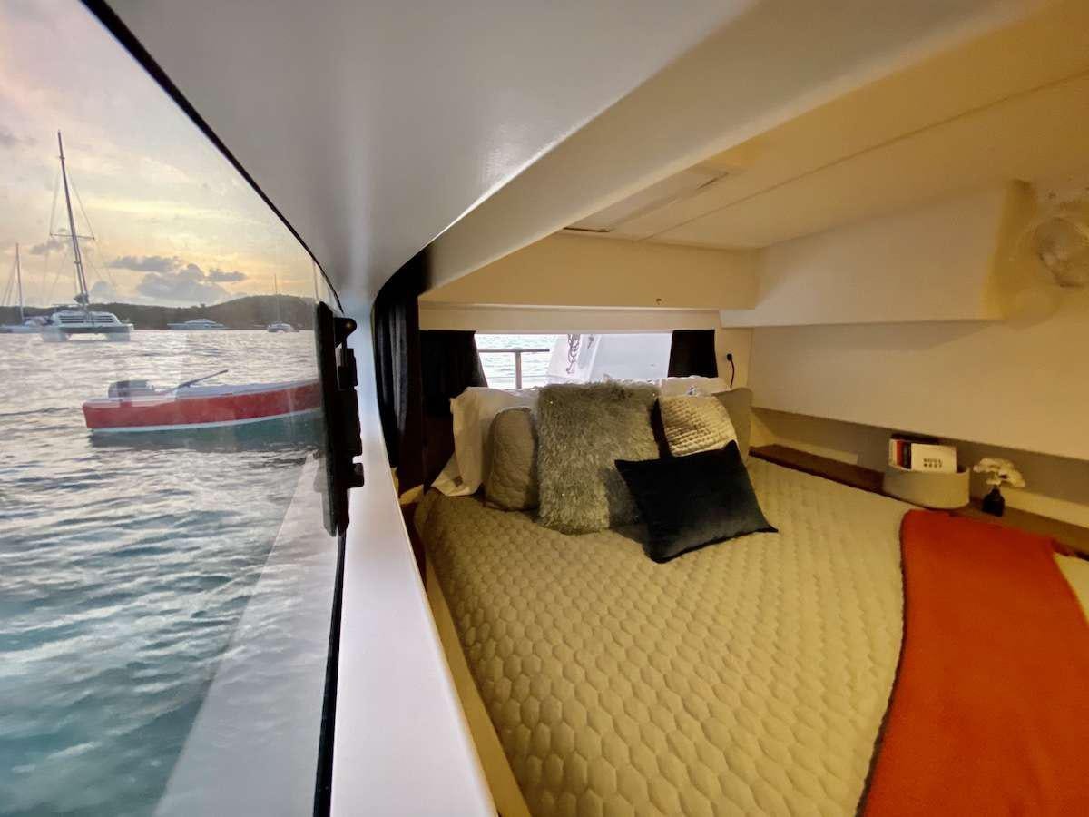 a bed with a large bed aboard HERO'S JOURNEY Yacht for Charter