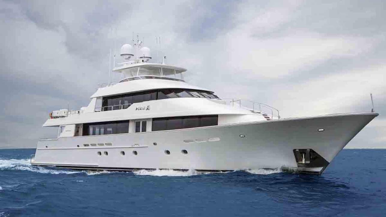 a large white yacht in the water aboard PLAN A Yacht for Charter
