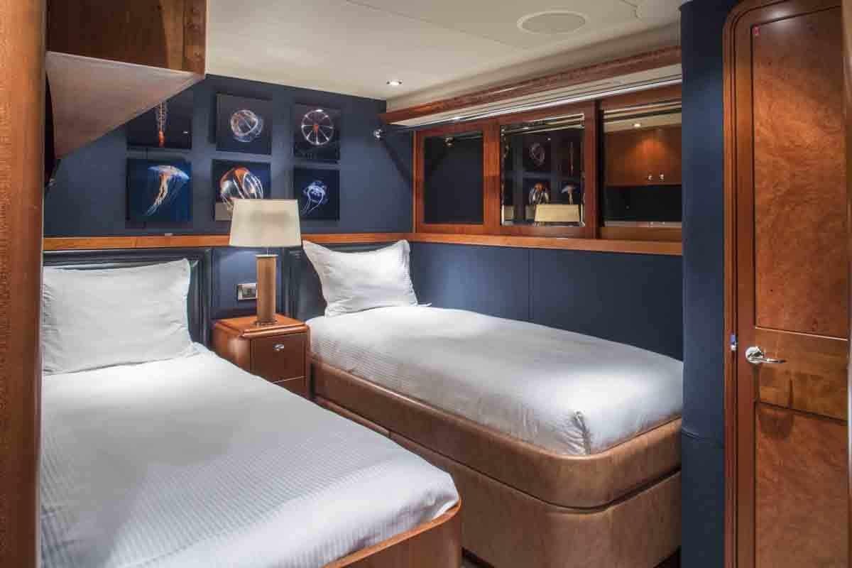 a couple of beds in a room aboard PLAN A Yacht for Charter