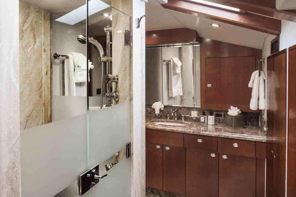 a bathroom with a large mirror aboard PLAN A Yacht for Charter