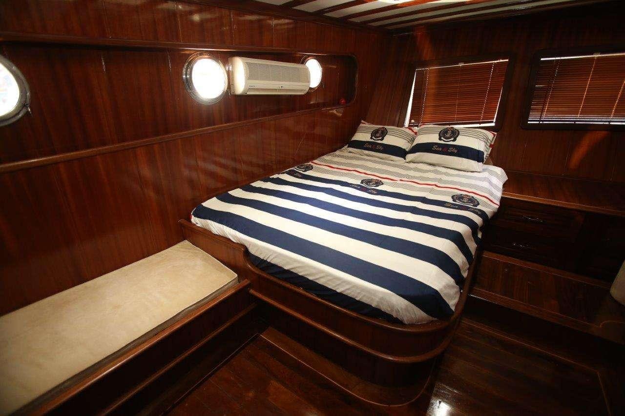 a bed in a cabin aboard SEMERCIOGLU IV Yacht for Charter