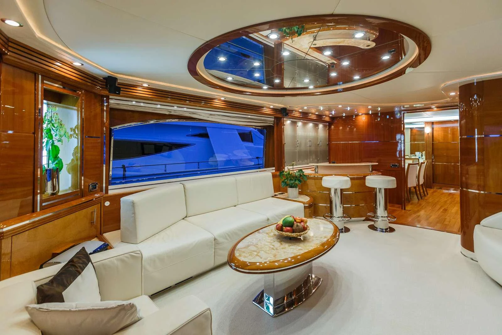 a living room with a large mirror aboard VELLMARI Yacht for Charter