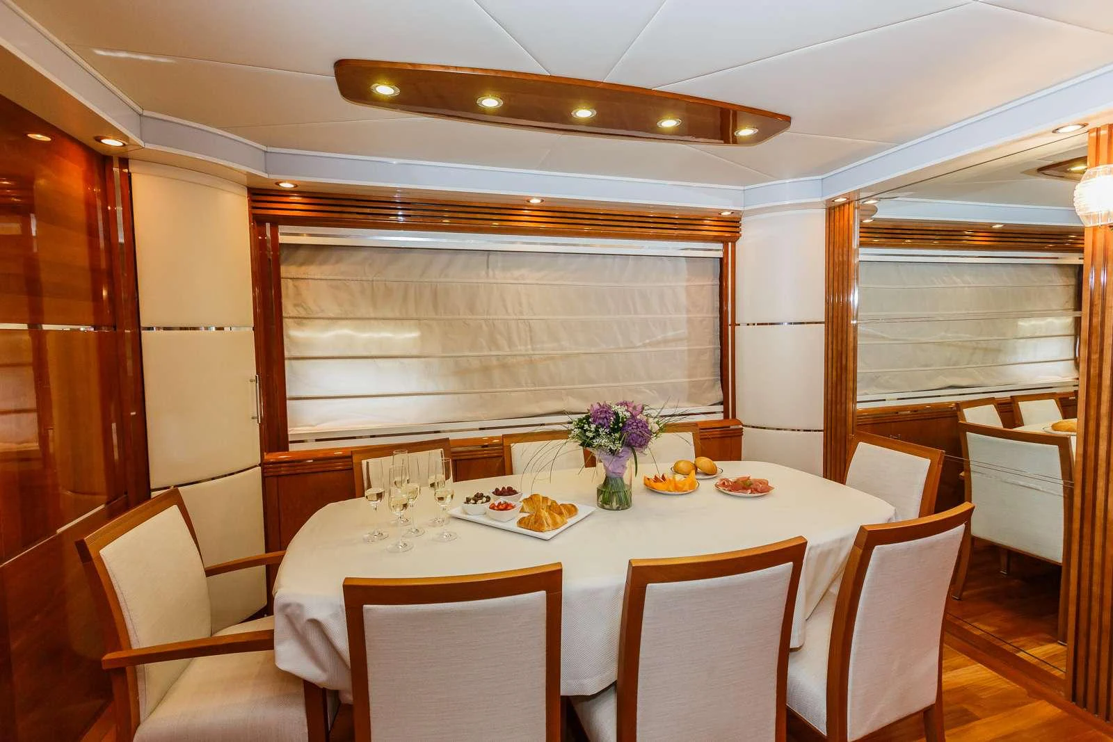 a dining room with a table set aboard VELLMARI Yacht for Charter