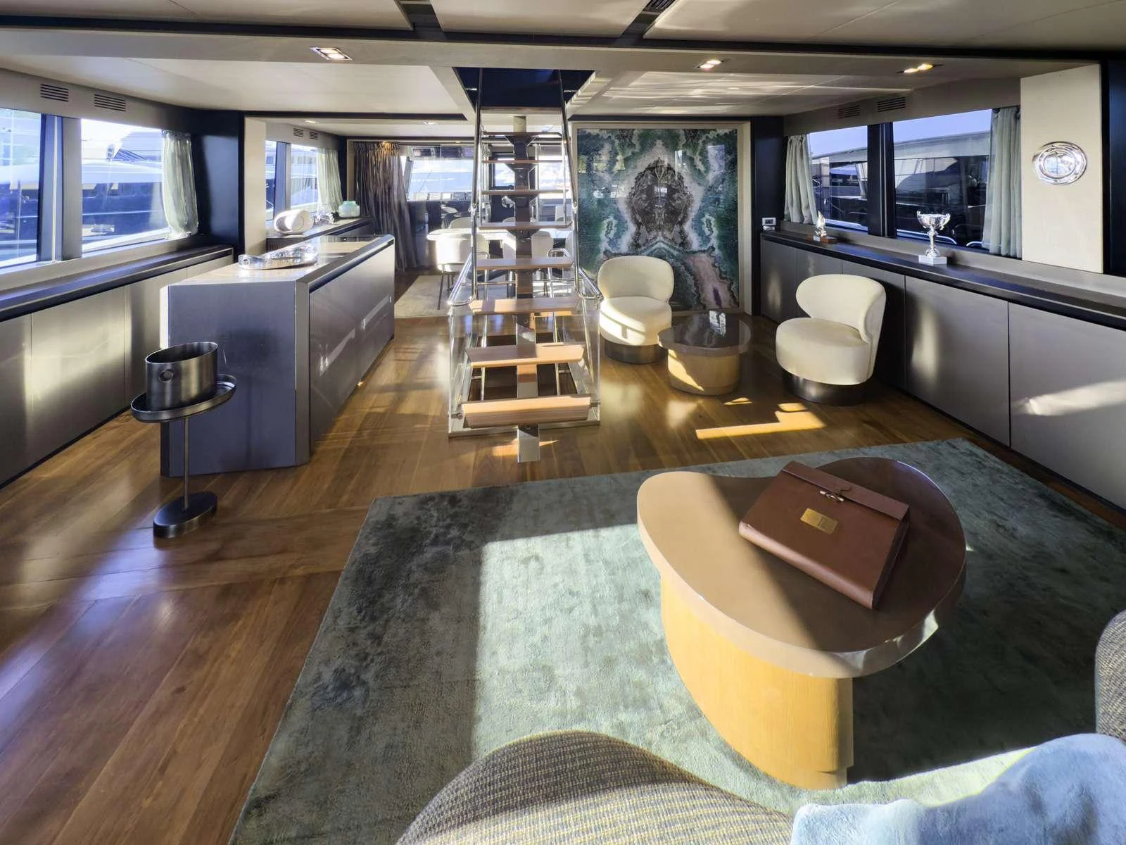 a room with a large rug and a chair aboard KOKONUT'S WALLY Yacht for Charter