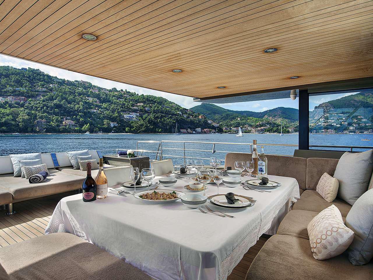 a table set for a meal aboard KOKONUT'S WALLY Yacht for Charter