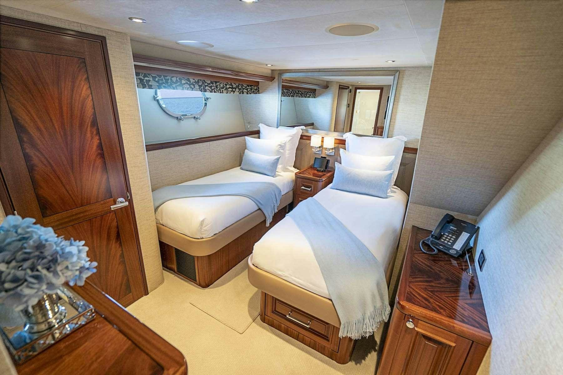 a room with two beds aboard ANTARES Yacht for Charter