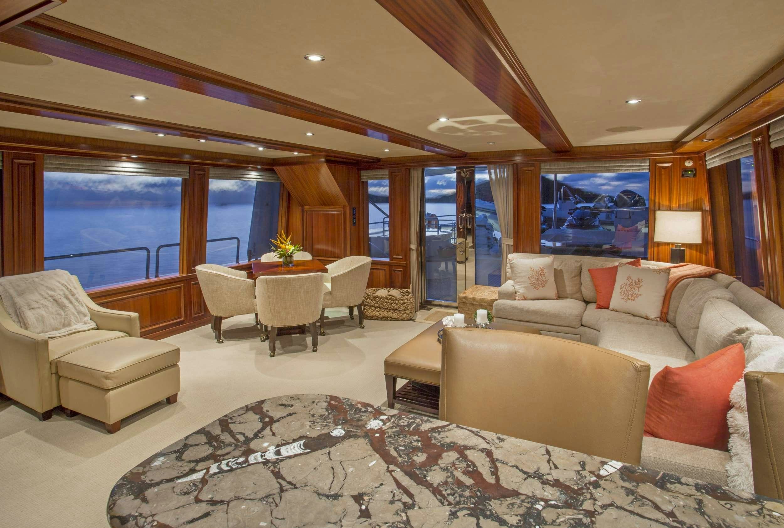 a living room with a large window aboard ANTARES Yacht for Charter