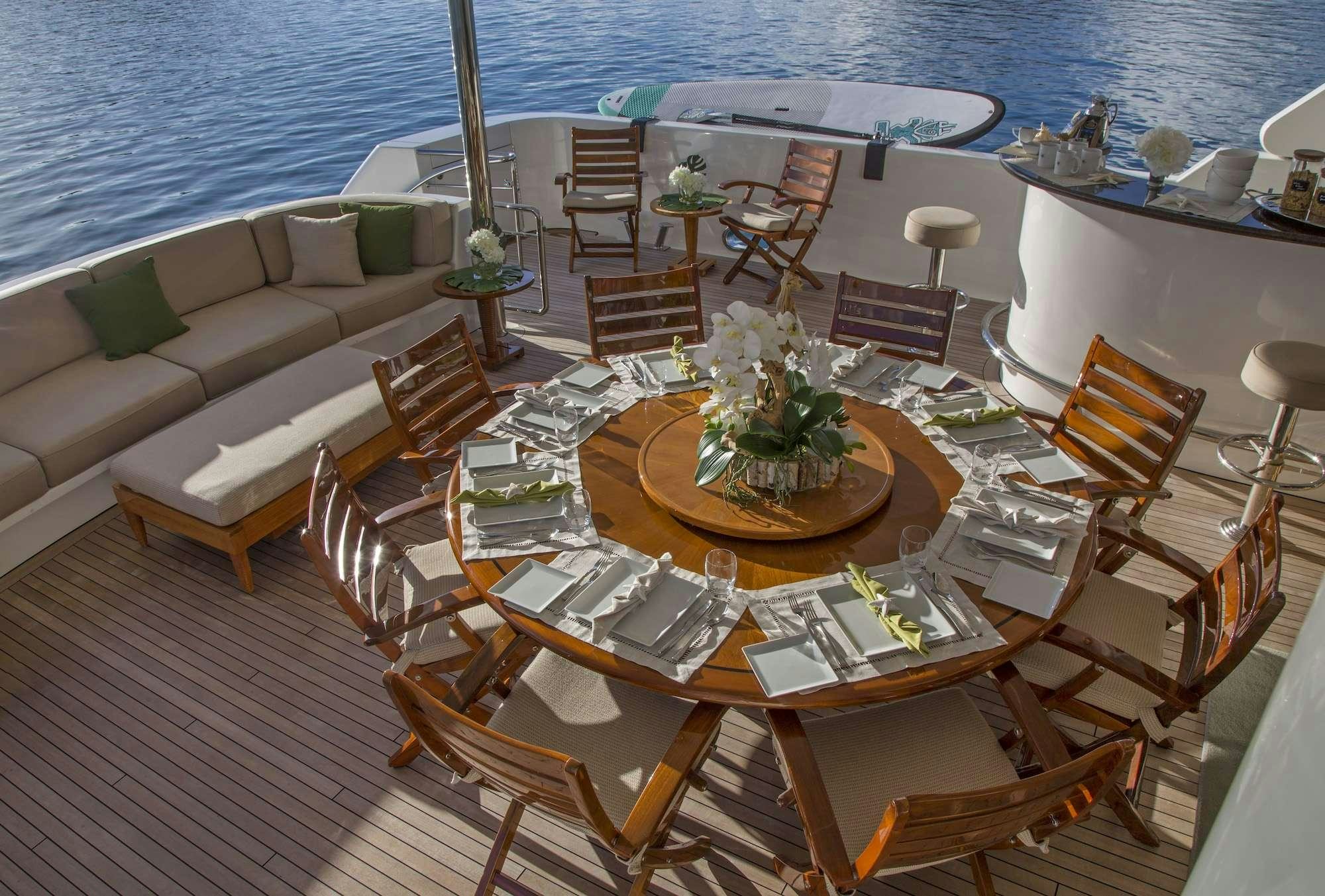 a room with a table and chairs aboard ANTARES Yacht for Charter
