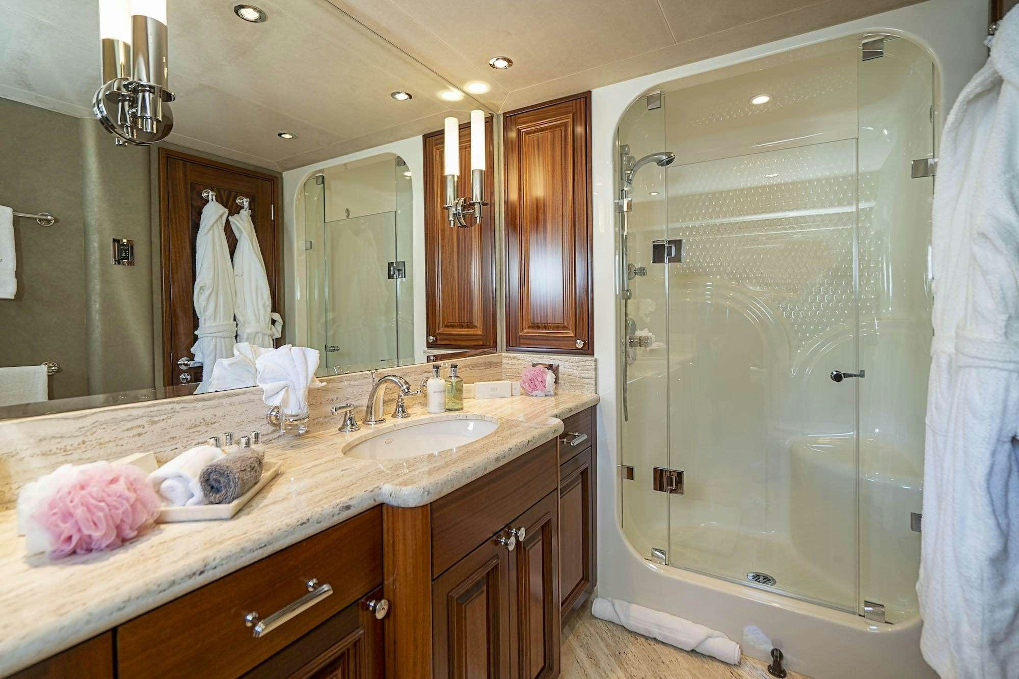 a bathroom with a large shower aboard ANTARES Yacht for Charter