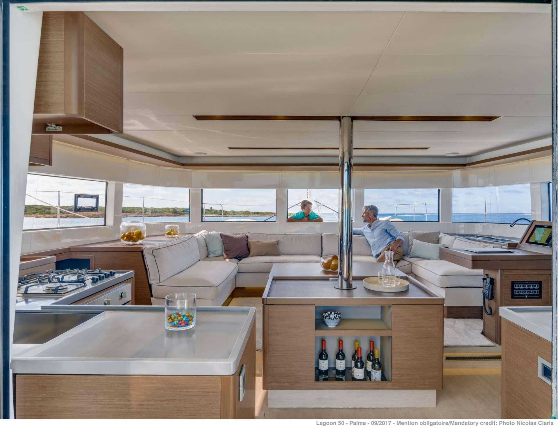a room with a couch and a table aboard HAPPY FEET Yacht for Charter