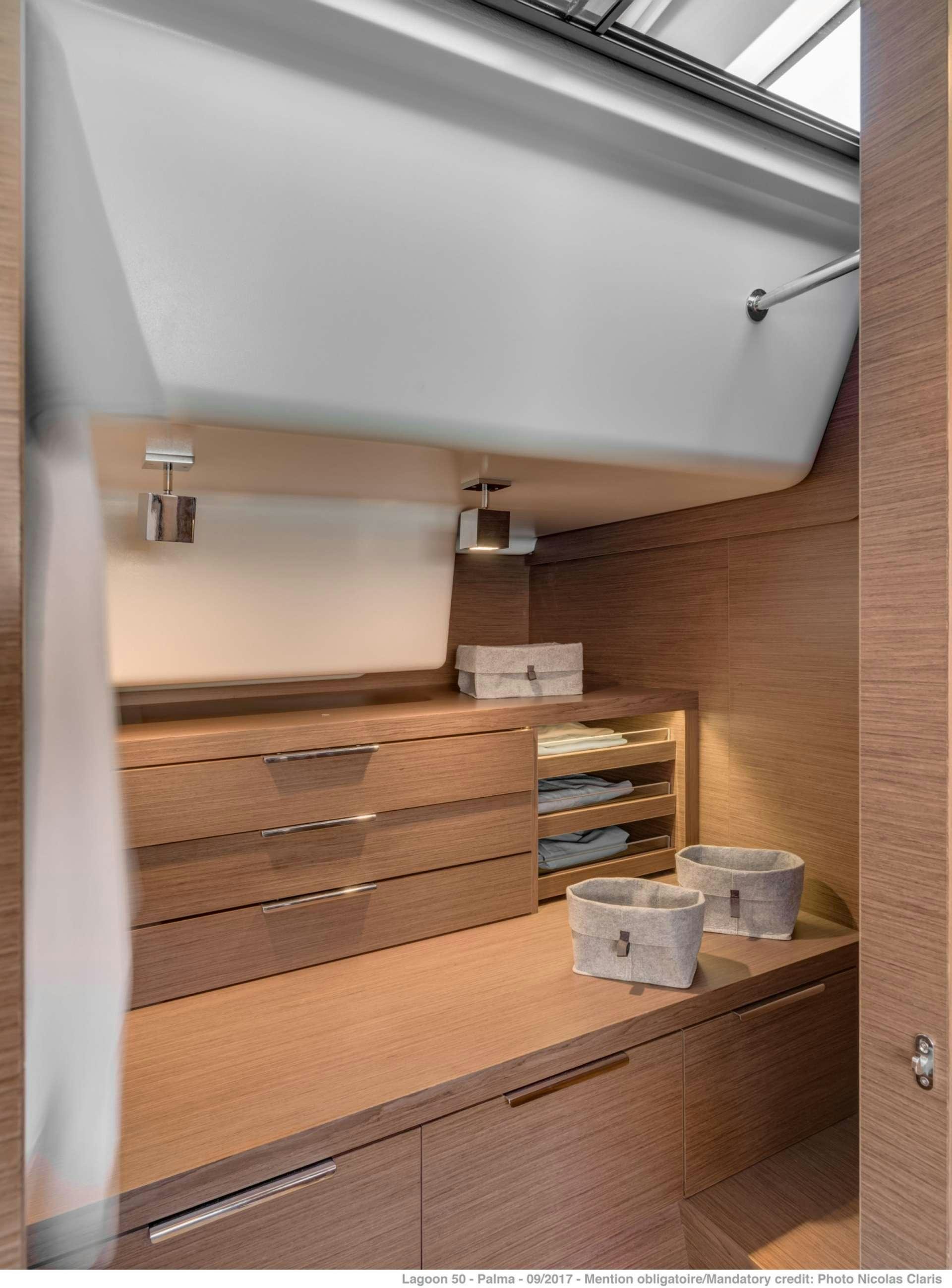 a wooden cabinet with a light above it aboard HAPPY FEET Yacht for Charter