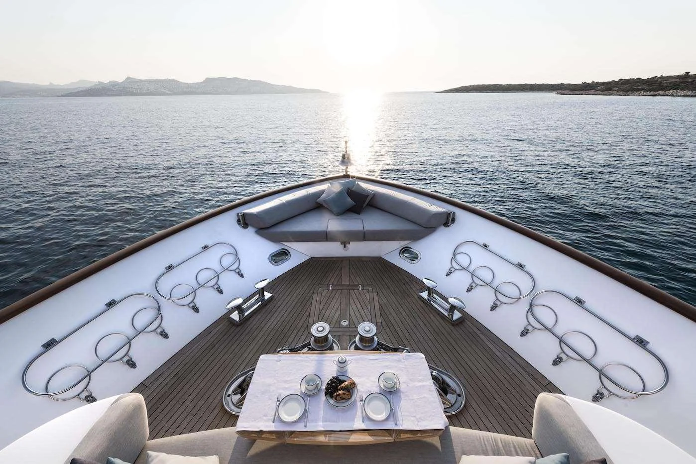 The foredeck offers a serene dining experience with panoramic ocean views. aboard KALIMERA Yacht for Charter