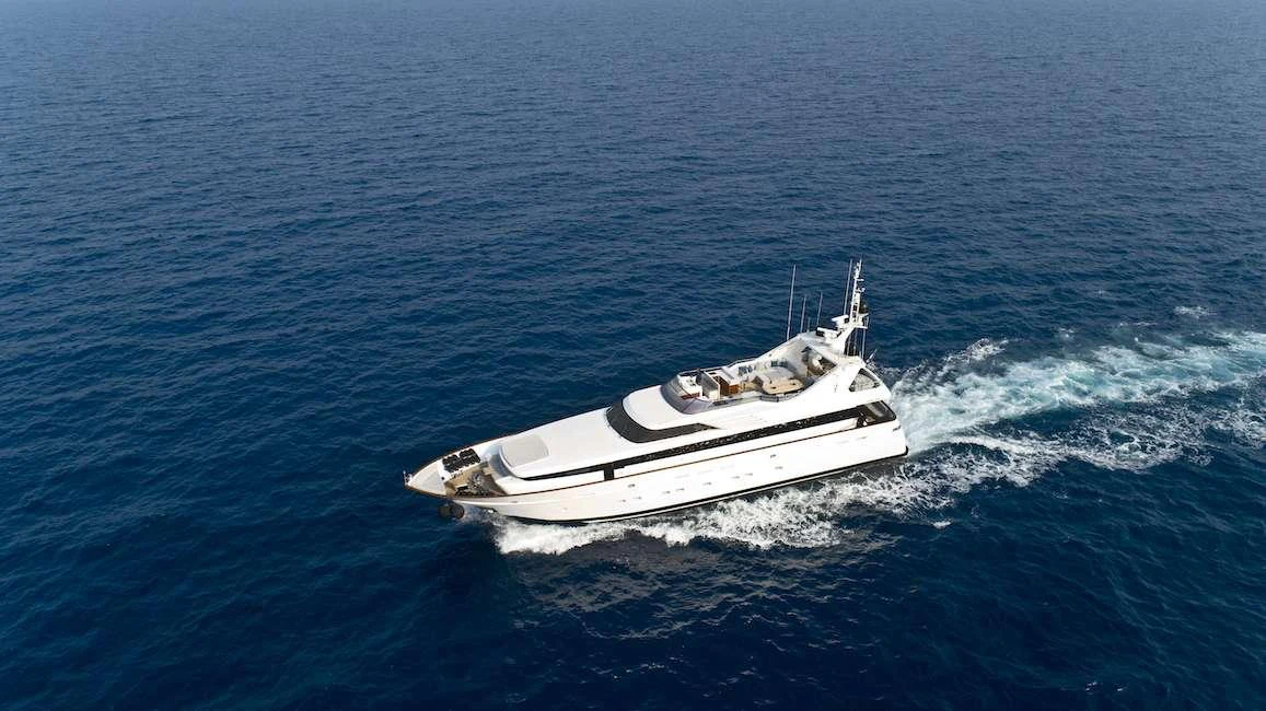 A sleek and modern yacht glides effortlessly through the open sea. aboard KALIMERA Yacht for Charter