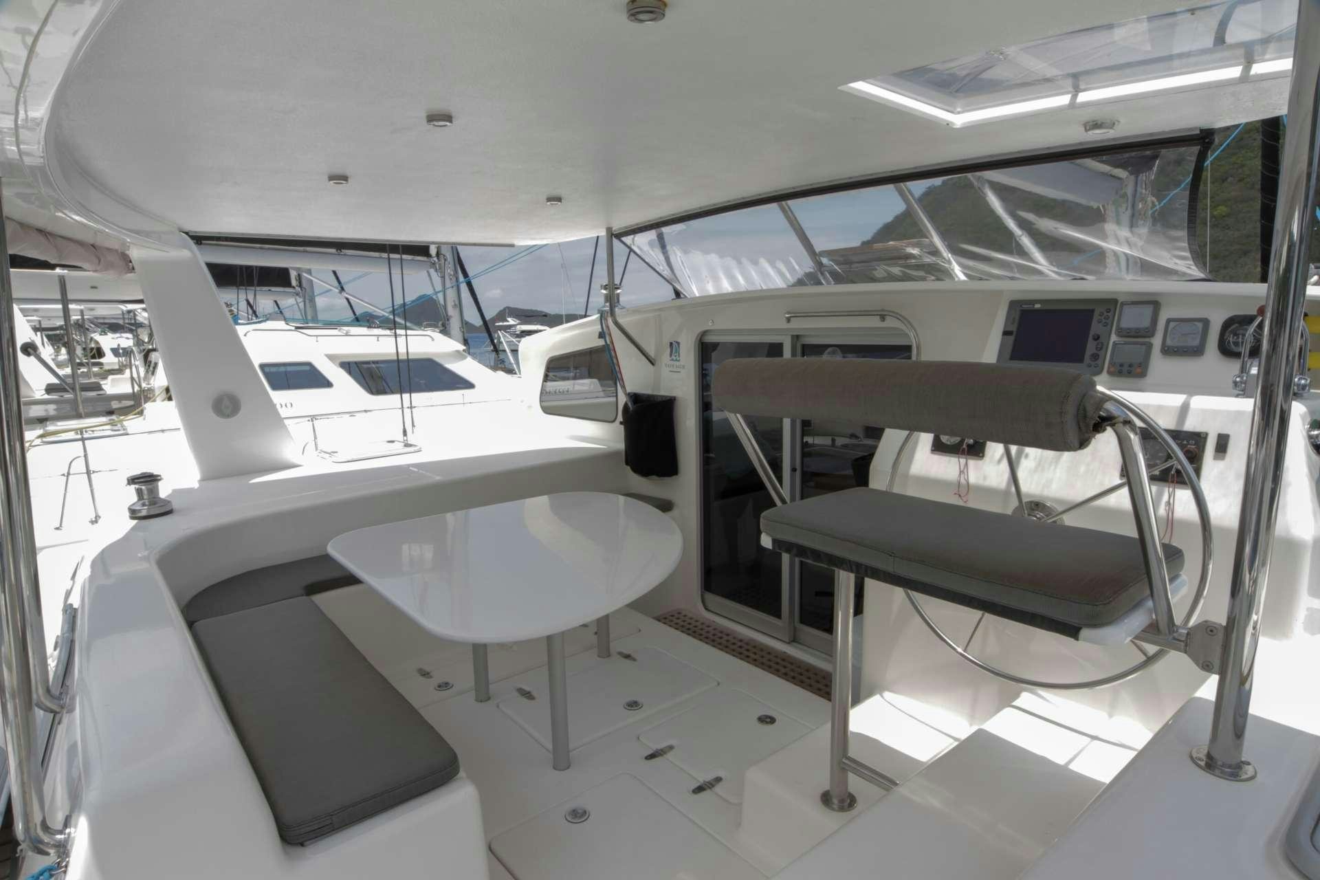 a room with a table and chairs aboard VOYAGE 500 Yacht for Charter