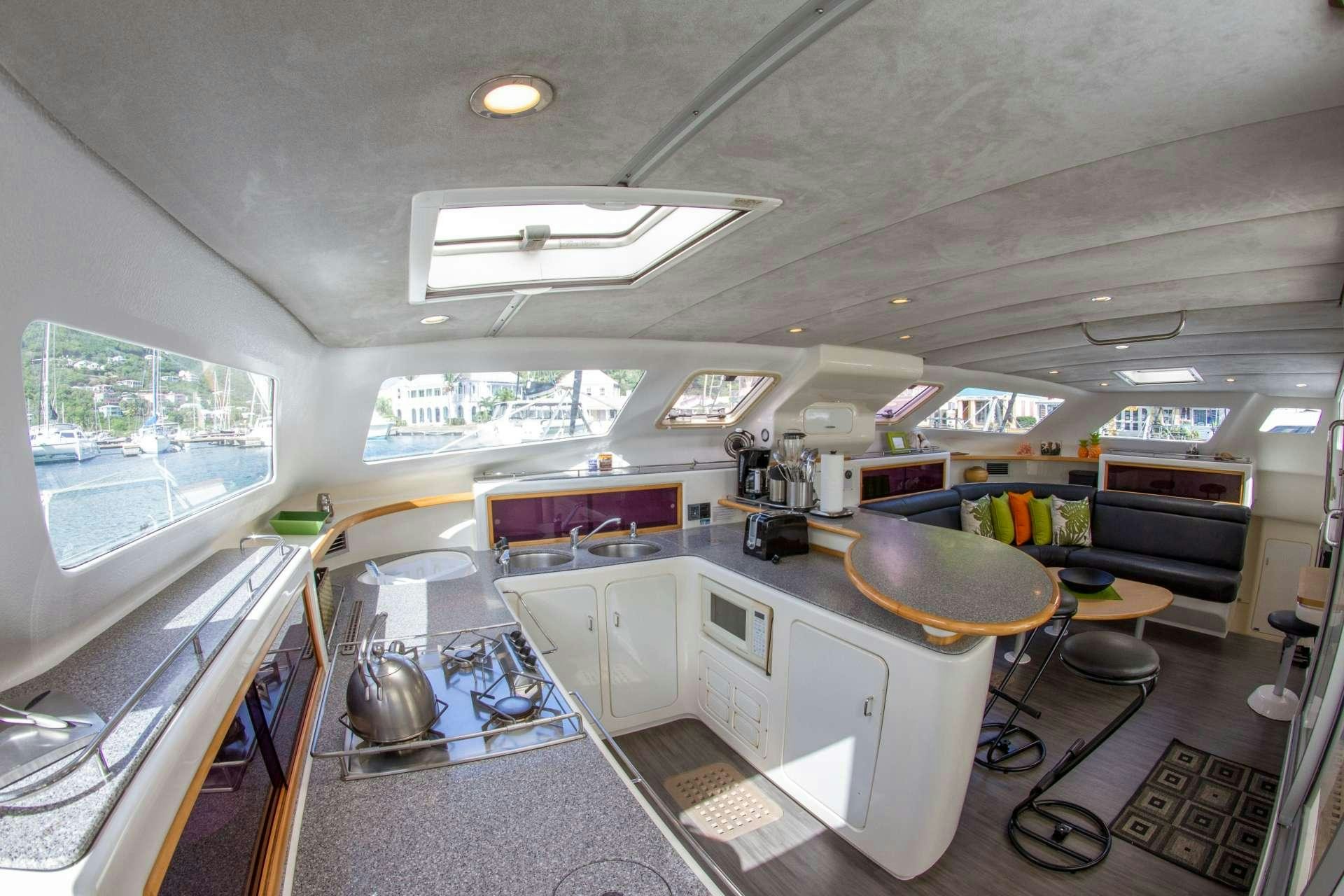 a room with a table and chairs aboard VOYAGE 500 Yacht for Charter