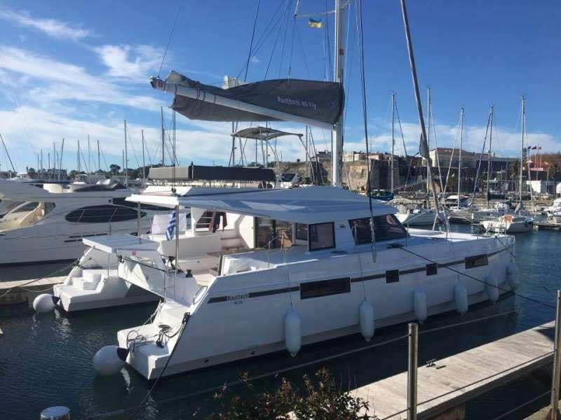 a boat docked at a pier aboard Sithonia Yacht for Charter